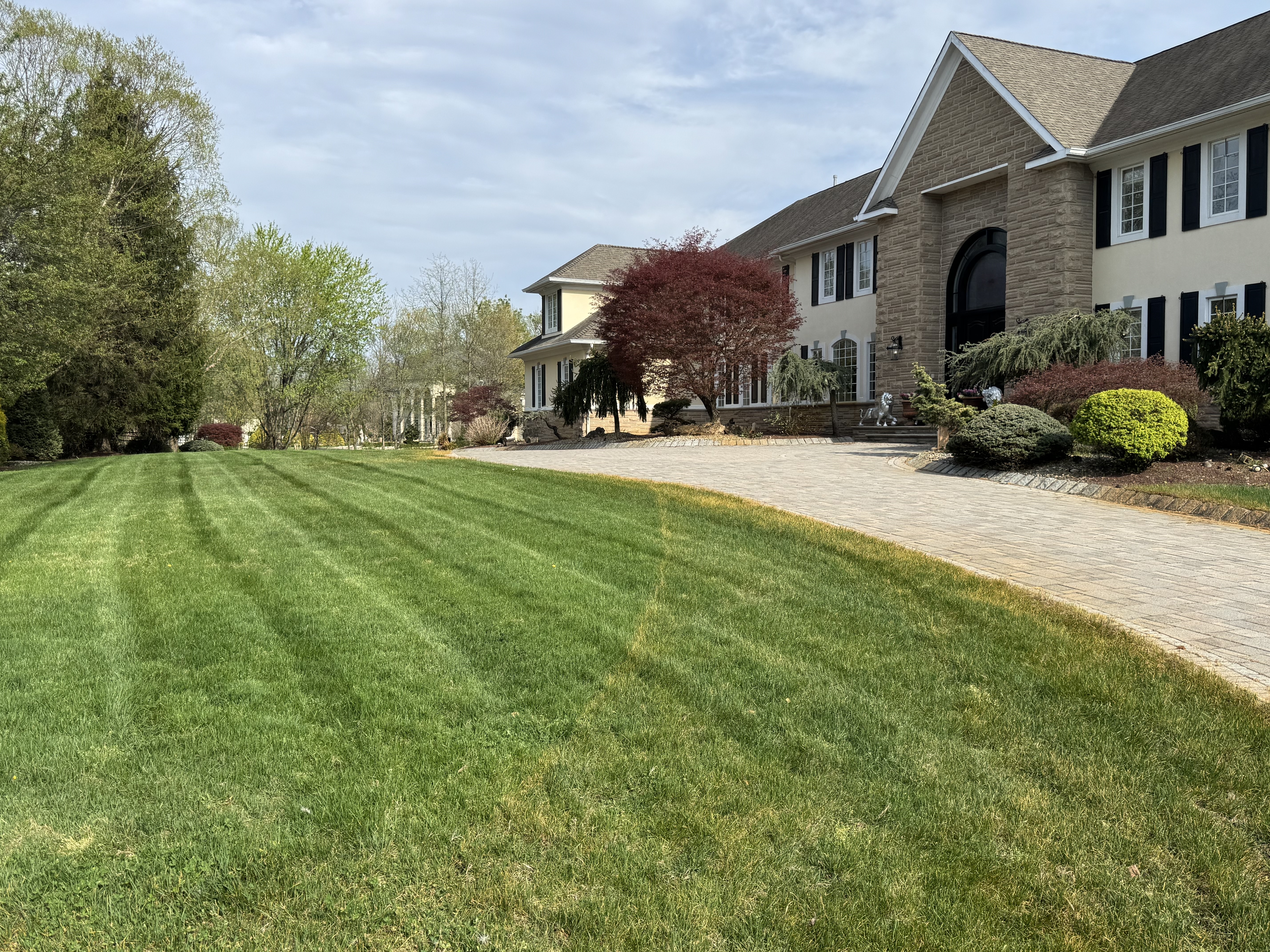 Luxury estate with striped lawn patterns